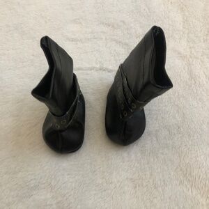 American Girl Doll black boots with gold detailing.